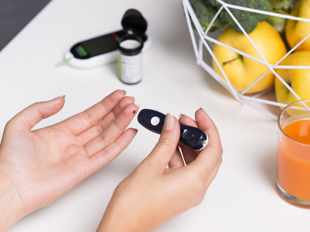 Female with pen glucometer